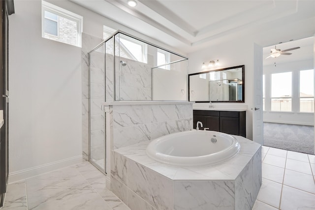 full bathroom featuring a shower stall, a garden tub, a healthy amount of sunlight, and baseboards