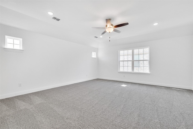 carpeted spare room featuring recessed lighting, visible vents, baseboards, and ceiling fan