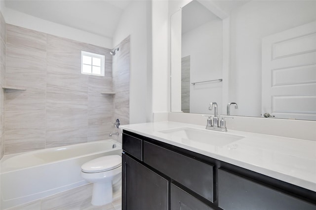 bathroom featuring toilet, vanity, and shower / tub combination