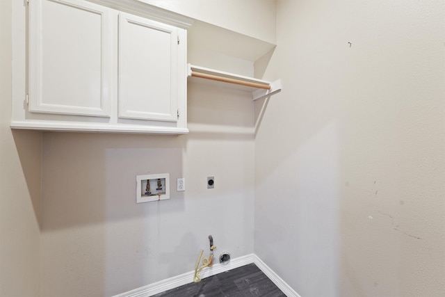 clothes washing area with dark wood-style floors, baseboards, electric dryer hookup, washer hookup, and hookup for a gas dryer