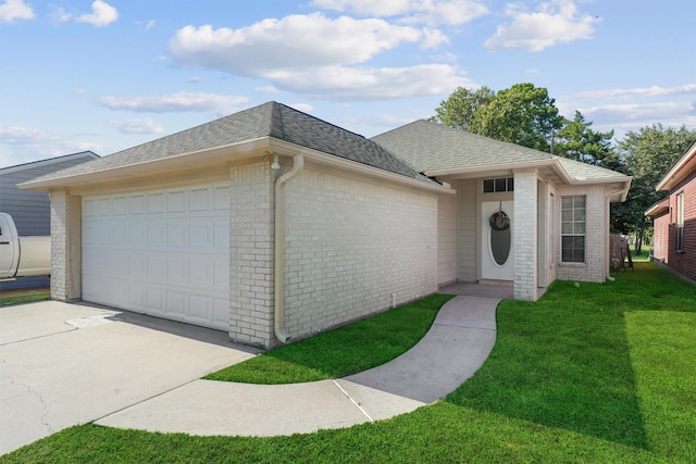 ranch-style house featuring driveway, roof with shingles, a front lawn, a garage, and brick siding