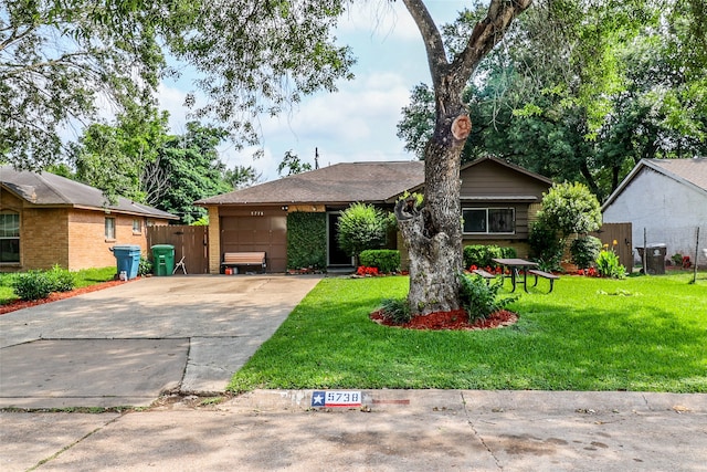 ranch-style house featuring a front lawn and central air condition unit