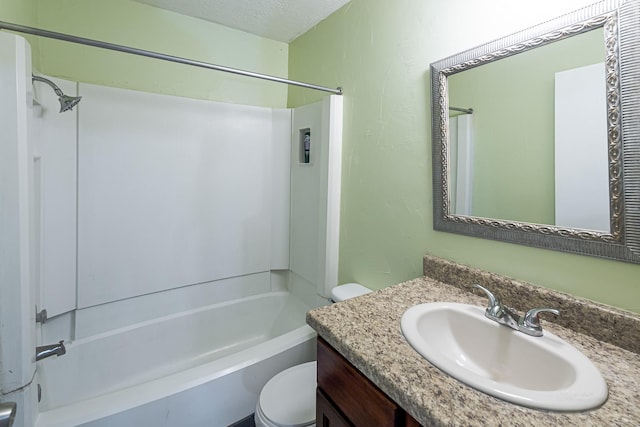 full bathroom with bathtub / shower combination, vanity, toilet, and a textured ceiling