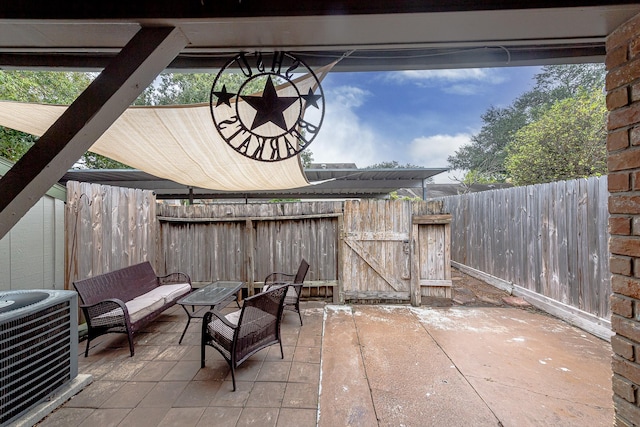 view of patio featuring an outdoor living space and central AC