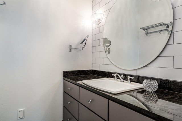 bathroom featuring backsplash and vanity