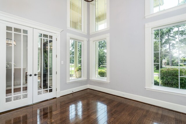 unfurnished sunroom with french doors and a healthy amount of sunlight