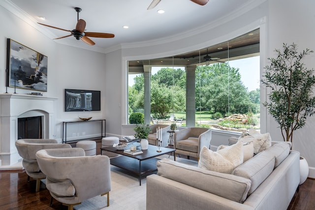 living room with plenty of natural light, hardwood / wood-style flooring, and ceiling fan