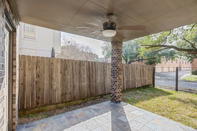 exterior space featuring ceiling fan and a patio