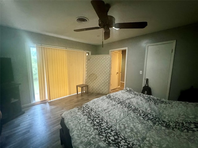 bedroom with hardwood / wood-style floors and ceiling fan