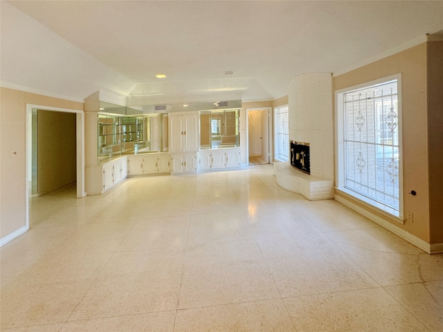 unfurnished living room with a brick fireplace