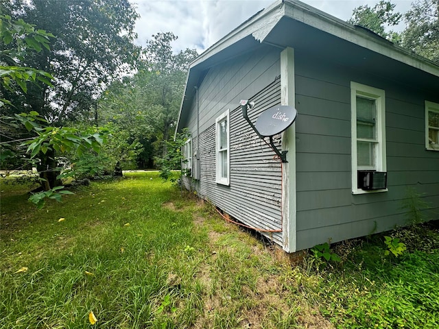 view of side of property with a yard