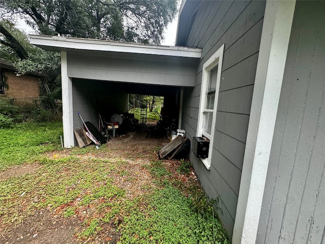 exterior space with a carport