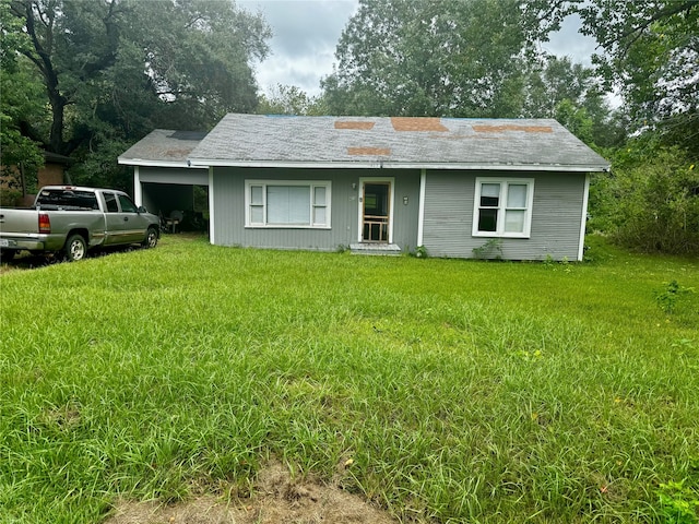 ranch-style home with a front lawn