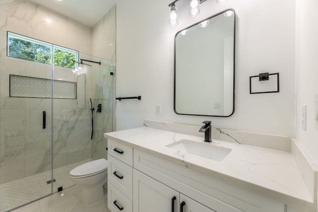 bathroom with walk in shower, vanity, and toilet