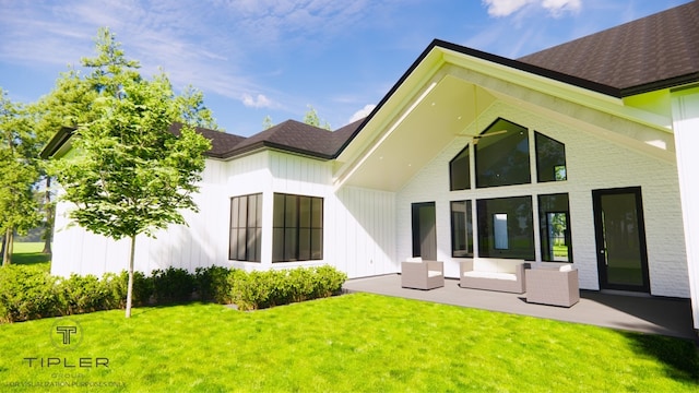 back of property featuring a patio area and a lawn