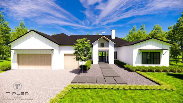 view of front facade featuring a front yard and a garage