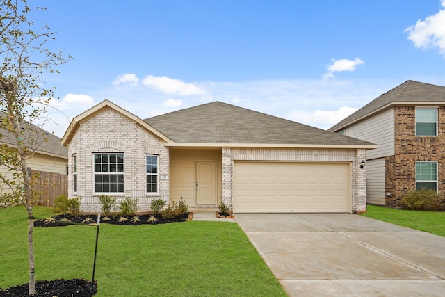 view of front of home featuring a garage and a front lawn