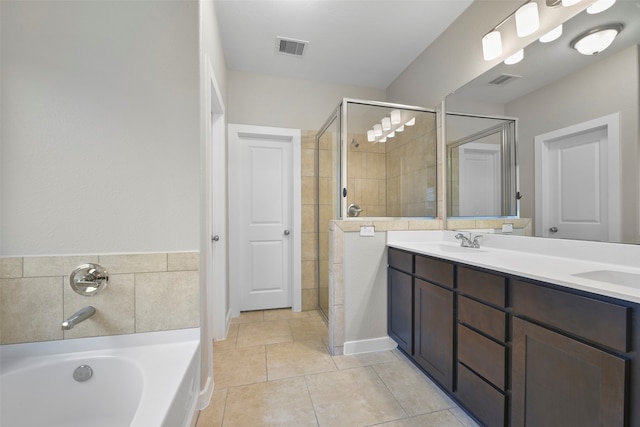 bathroom featuring vanity, tile patterned floors, and plus walk in shower