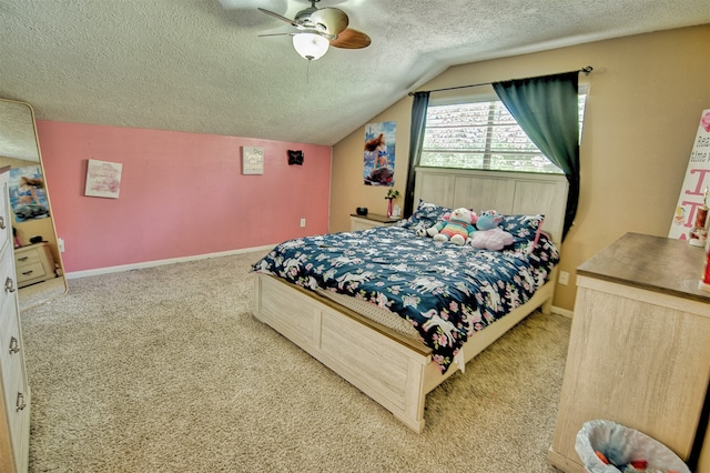 bedroom featuring ceiling fan, a textured ceiling, lofted ceiling, and carpet