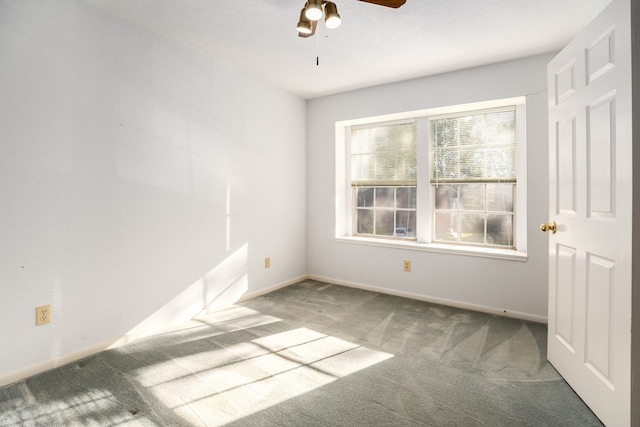 unfurnished room with carpet flooring and ceiling fan