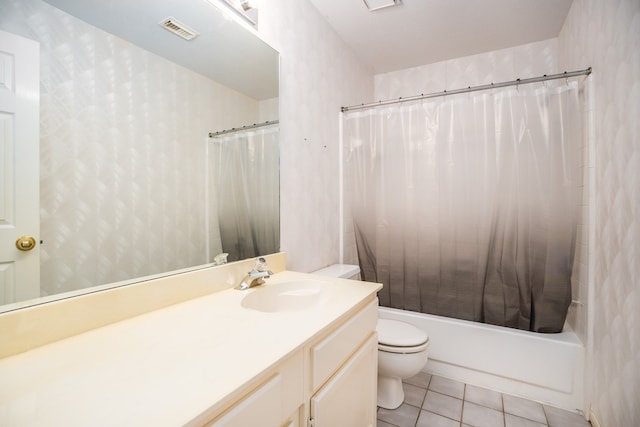 full bathroom with shower / bath combo with shower curtain, tile patterned flooring, vanity, and toilet