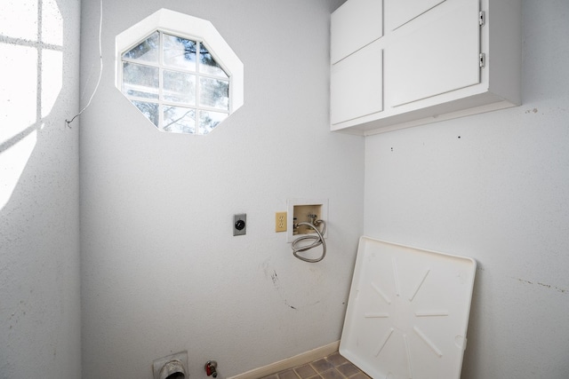 laundry room with cabinets, hookup for a washing machine, and electric dryer hookup