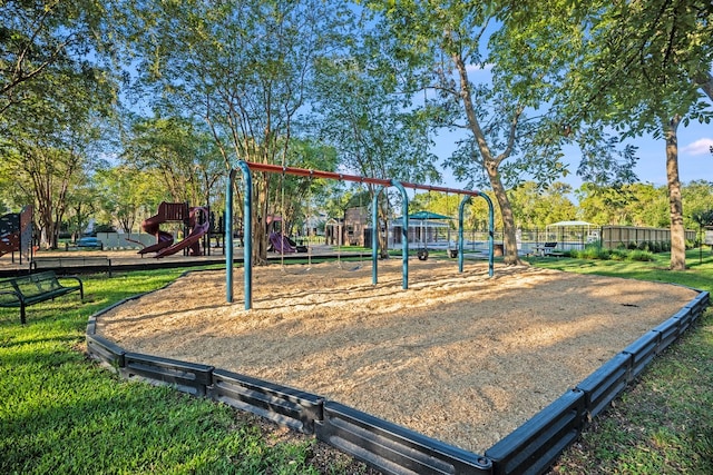 view of playground with a lawn