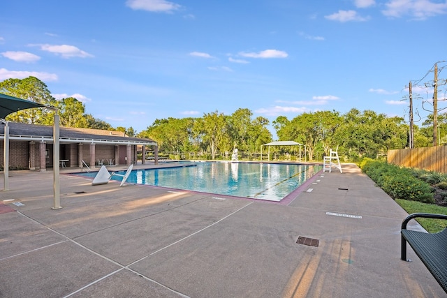 view of swimming pool with a patio area