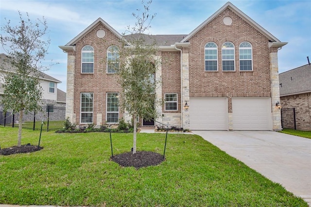 view of front of property with a garage and a front lawn