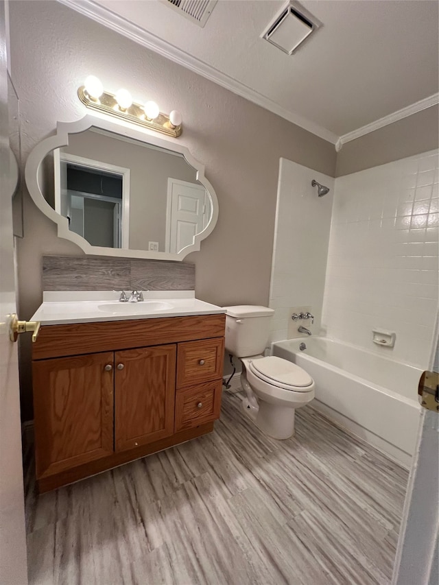 full bathroom with vanity, toilet, hardwood / wood-style floors, and washtub / shower combination