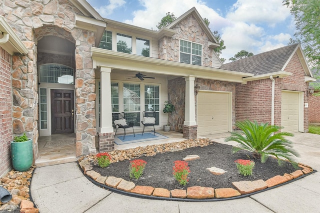 view of front of home with ceiling fan, a garage, and a porch