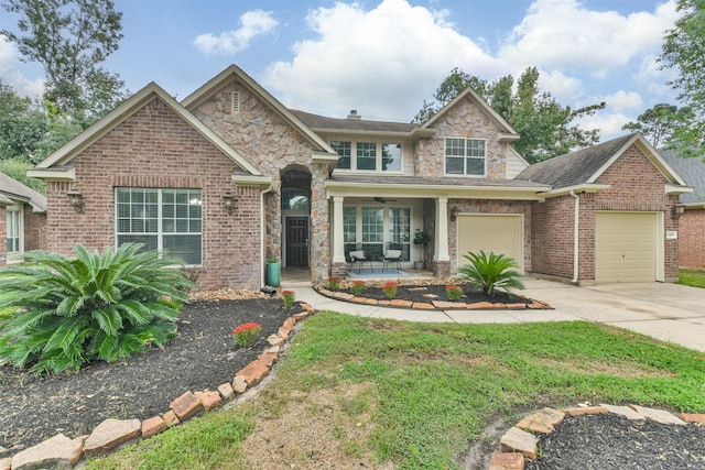 view of front of home with a porch and a garage