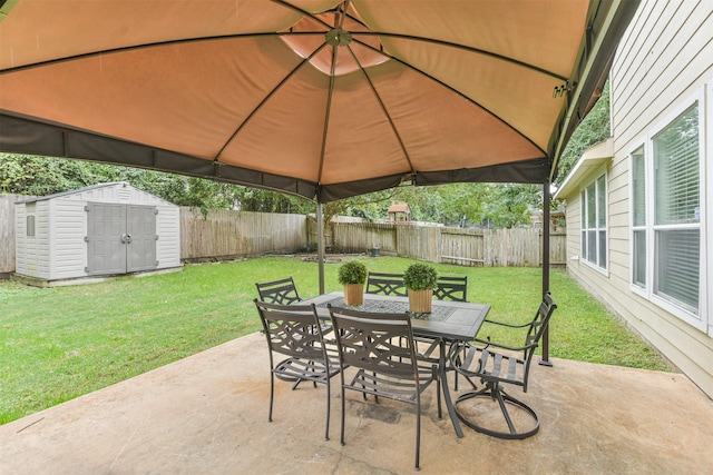 view of patio / terrace with a gazebo and a storage unit