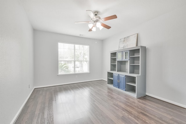 unfurnished bedroom featuring ceiling fan and wood-type flooring