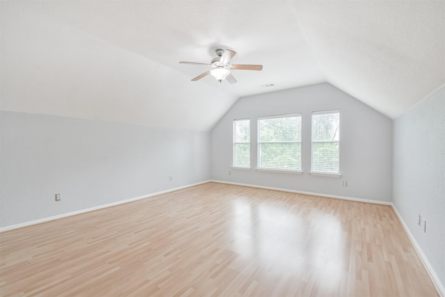 bonus room featuring ceiling fan, vaulted ceiling, and light hardwood / wood-style flooring