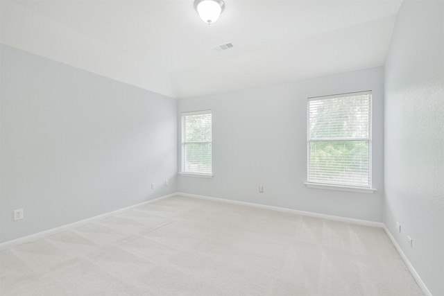 empty room featuring light colored carpet