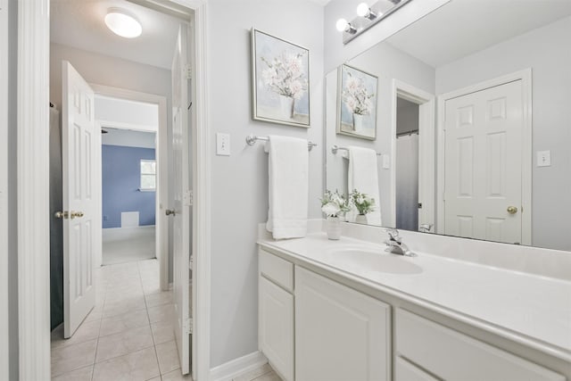 bathroom with vanity and tile patterned flooring