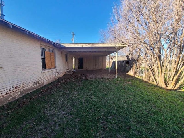 view of yard featuring a carport