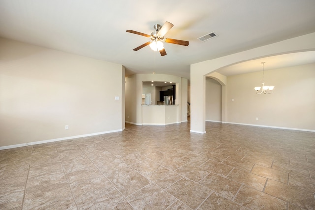 interior space with ceiling fan with notable chandelier