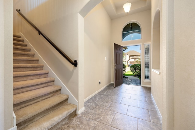 entryway with light tile patterned floors