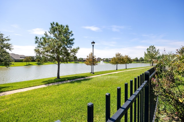 exterior space featuring a water view and a yard