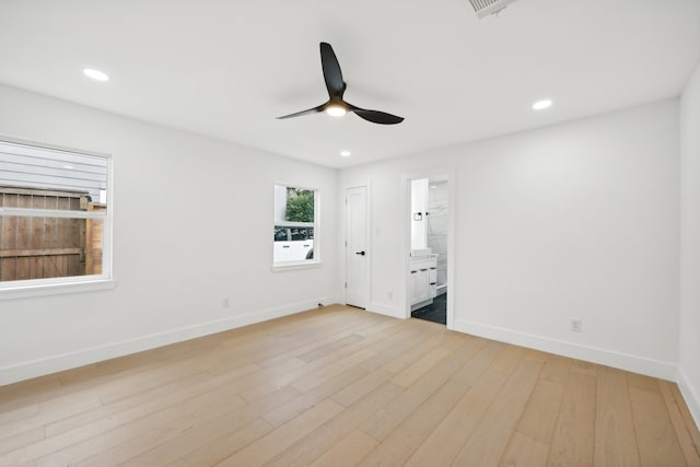 unfurnished bedroom featuring ceiling fan, connected bathroom, and light hardwood / wood-style floors