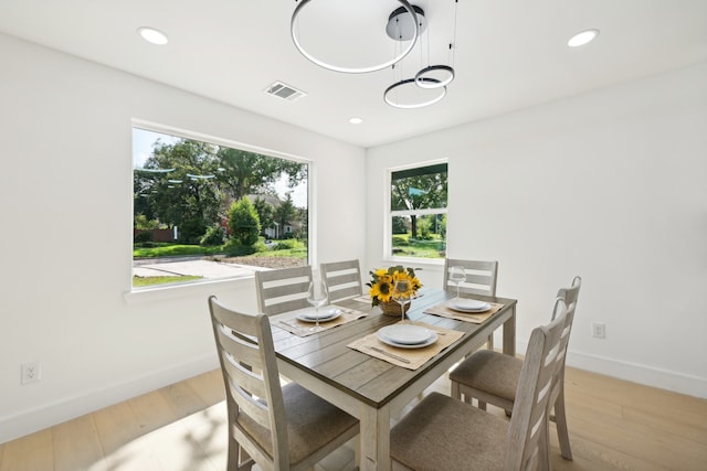 dining area featuring a wealth of natural light and light hardwood / wood-style floors