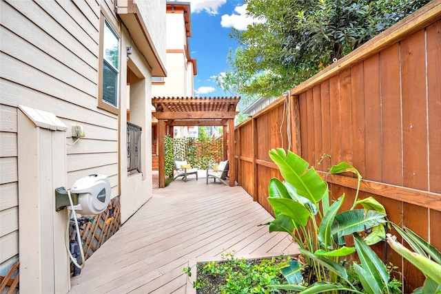 wooden deck featuring a pergola