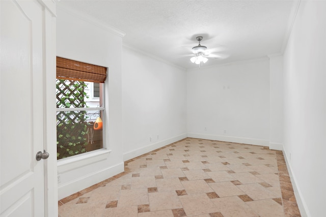 spare room featuring crown molding, a textured ceiling, and ceiling fan