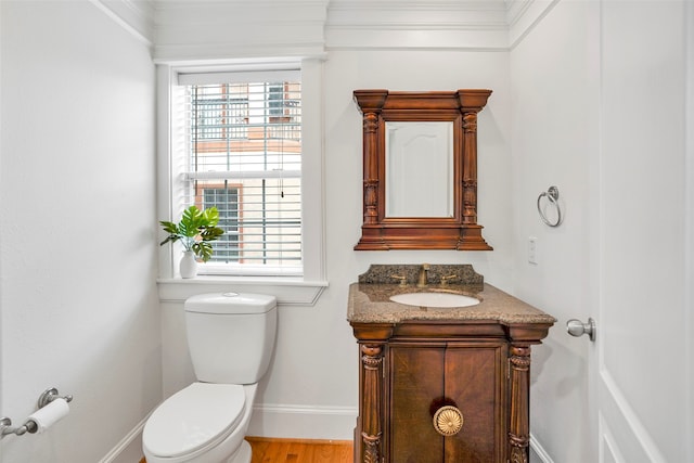 bathroom featuring hardwood / wood-style floors, toilet, and vanity