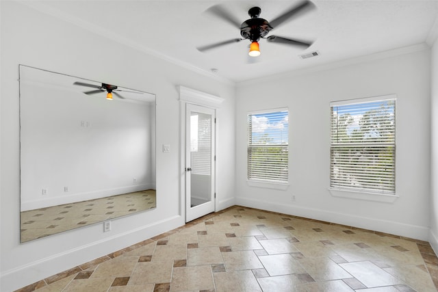 empty room featuring ceiling fan and ornamental molding