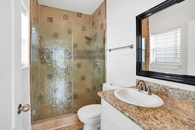 bathroom featuring tile patterned floors, walk in shower, toilet, and vanity