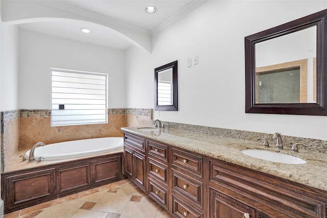 bathroom featuring a tub to relax in, vanity, ornamental molding, and tile patterned flooring