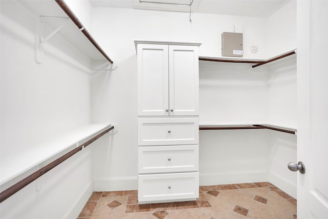 spacious closet featuring light tile patterned floors